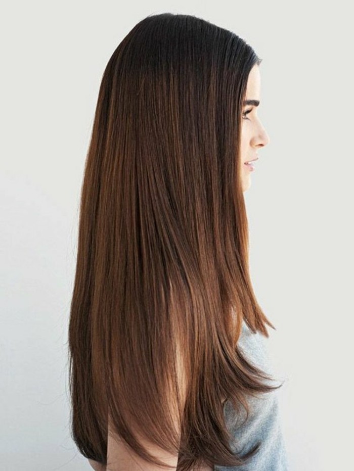 straight and smooth, layered long brown hair, brunette hair colors, worn by young woman, in pale grey tank top