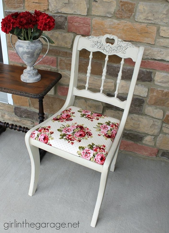rose patterned fabric in pink, green and white, on antique wooden chair, painted in white