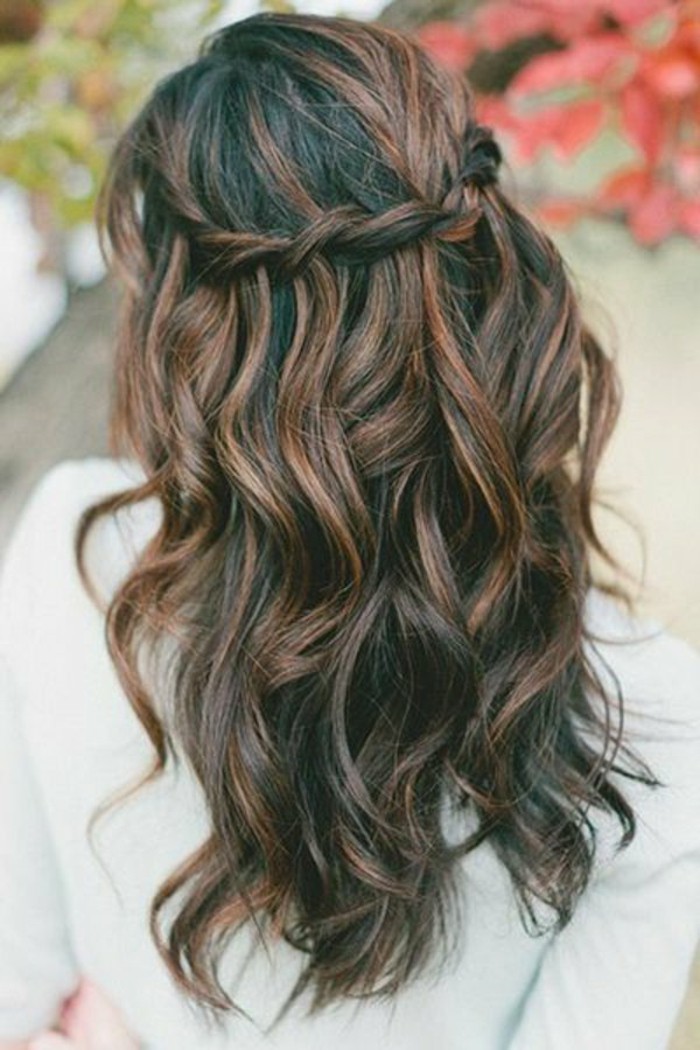 braided and curled hair, brunette hair colors, dark brown with reddish brown highlights, on woman in white jumper