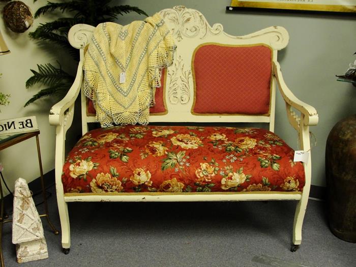 throw in yellow and pale blue, on cream and red french sofa, settee cushion features a red, orange and green floral print