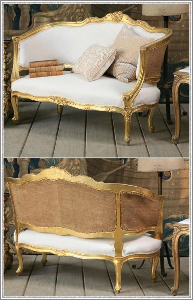 golden legs and armrests, on white french sofa, with rough beige back, shabby chic aesthetic , cushions and vintage books