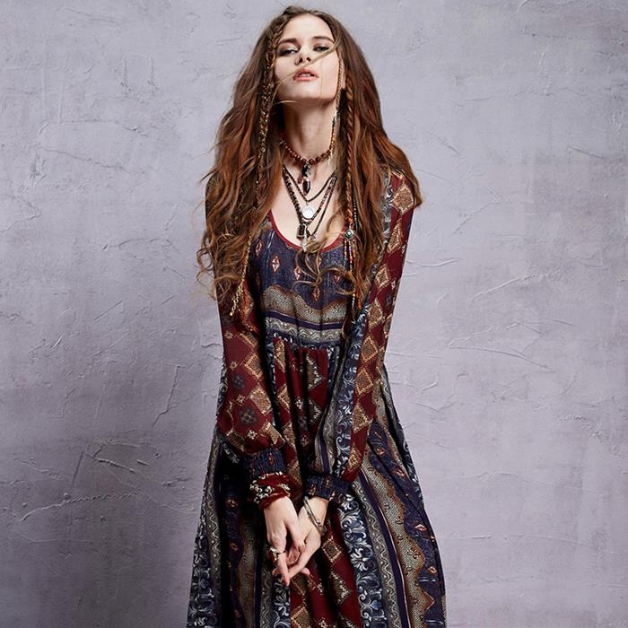 boho chic maxi dess, in burgundy and navy, with grey and brown indian print, worn with several oriental pendants, by brunette woman with long hair, and two small braids