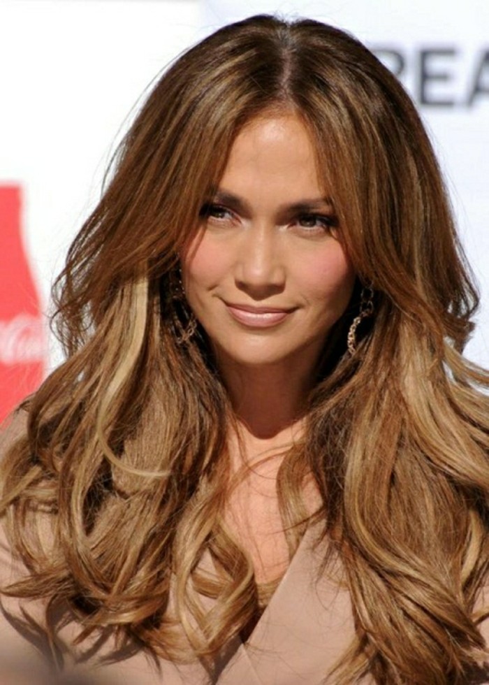 honey-blonde wavy layered hair, parted in the middle, with dark brunette roots, dark haired actresses, worn with a pale pink top, and discreet make up, by jennifer lopez