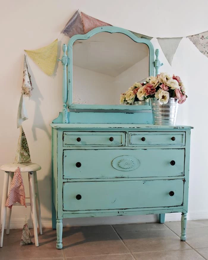 teal antique dresser with mirror, country chic décor, two small drawers and two large ones, pink and white peonies in a silver-colored bucket