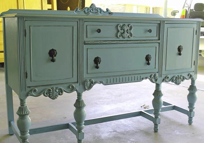 pastel turquoise antique cupboard, with ornaments and black handles, country cottage furniture