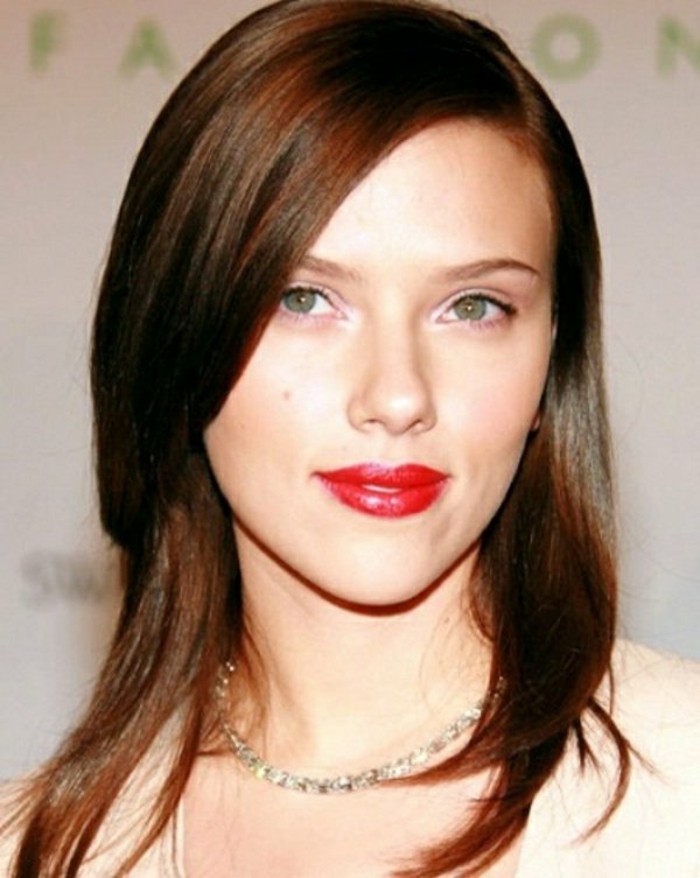 reddish-brunette medium length brown hair, with a side parting, layered and straight, worn by scarlett johansson, with bright red lipstick