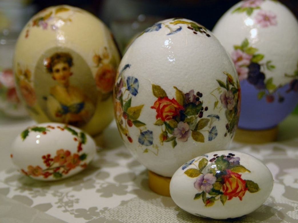 stickers depicting a woman, roses and other flowers, on white and yellow eggs, of different sizes, easter egg coloring and decorating 