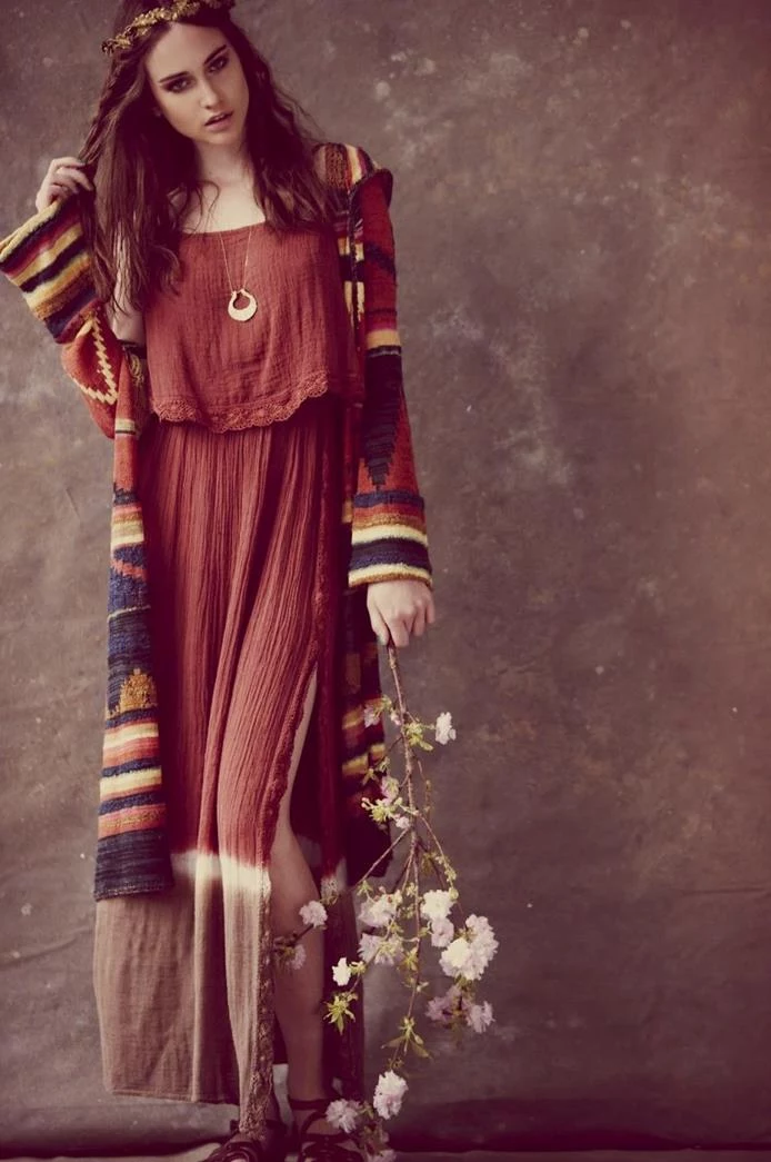 dip-dyed red dress, with brown hem and side slit, worn with multicolored, ethnic print oversized cardigan, by brunette woman, holding a blossoming tree branch