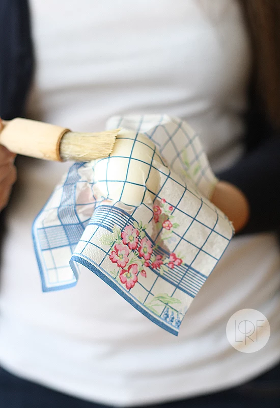 easter egg decorating, using a brush to apply egg whites, on paper napkin, placed over an egg, decoupage technique