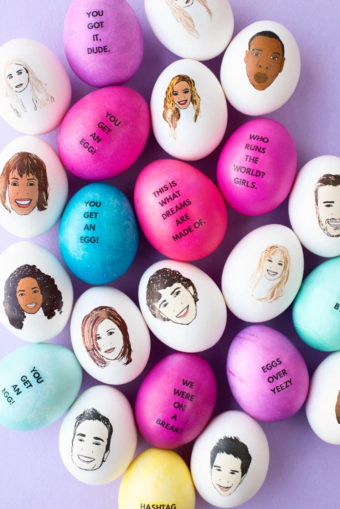 celebrities cartoons painted on white eggs, whitney houston and oprah winfrey, kanye west and justin timberlake, beyonce and jennifer aniston, other eggs are painted in pink, blue and yellow, and feature quotes