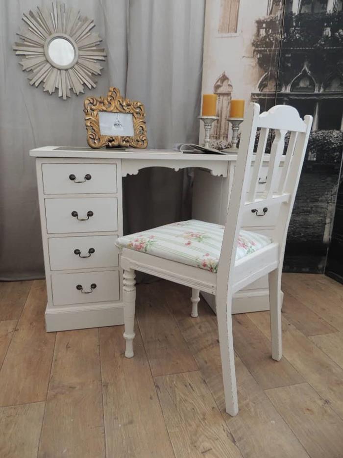 set of white antique desk and chair, shabby chic style, photo in ornate golden frame, candles and round decorative mirror