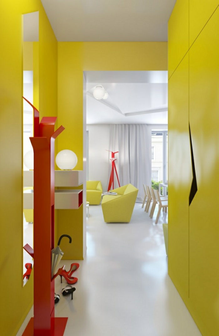 yellow walls and wardrobe, inside a small hall, with bright red coat hanger, hallway decor ideas, white smooth floor, livingroom in the background