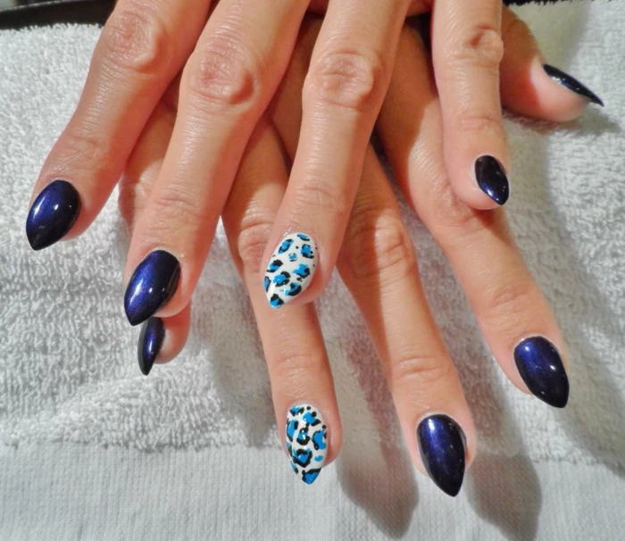 electric dark violet, and white nail polish, decorated with animal print, in light and dark blue, leopard spots style, short stiletto nails 