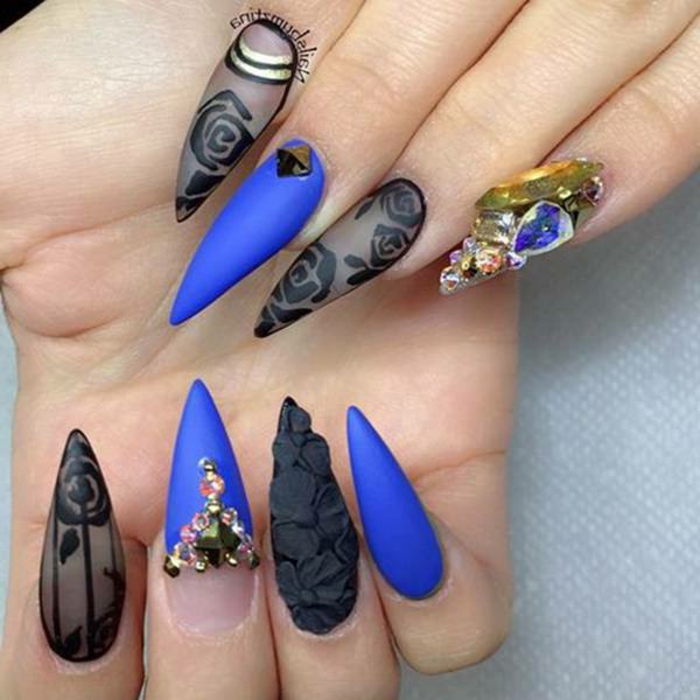 rose drawings and black 3D flower details, on blue and sheer black stiletto nails, decorated with varous gem stickers