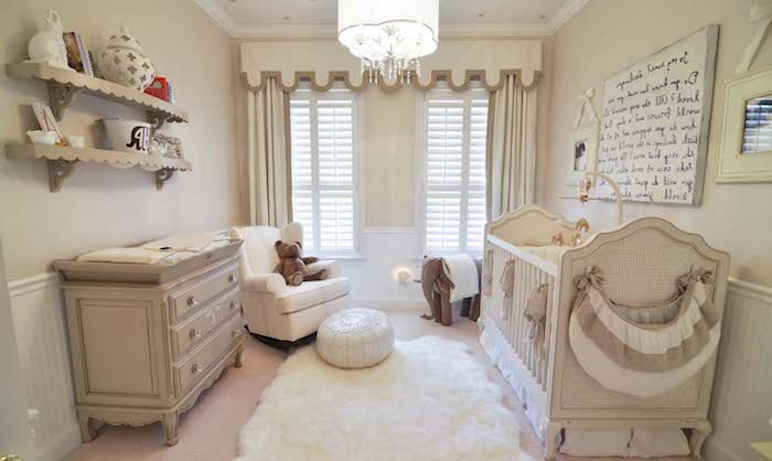 off-white and pale beige baby nursery, with vintage crib, and matching changing table with drawers, armchair and toys