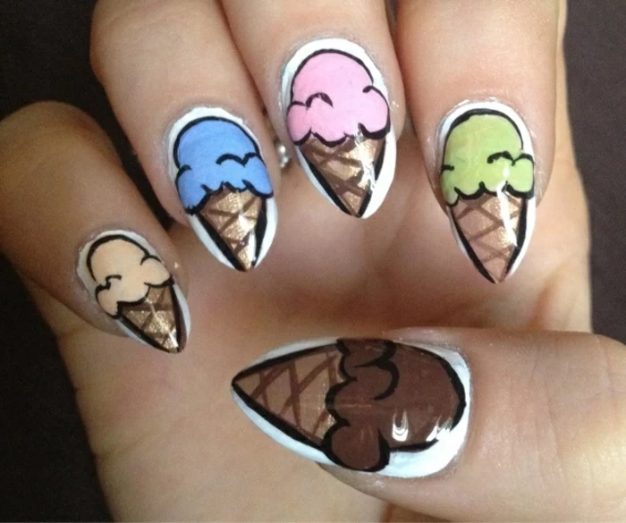 hand-painted ice-creams, in pale orange, blue and pink, green and brown, on short stiletto nails, with white nail polish 
