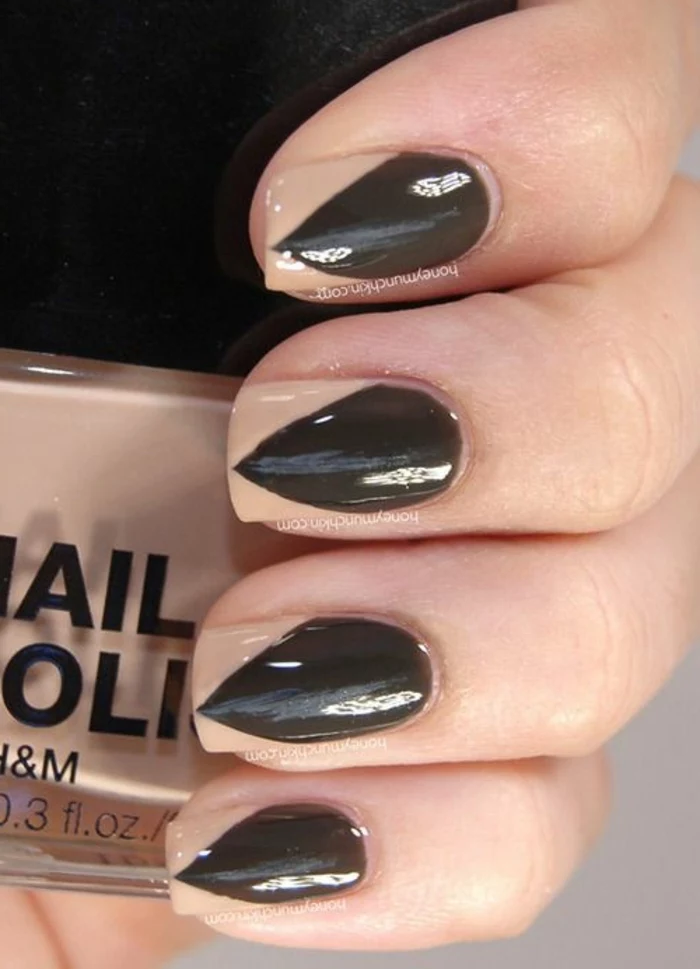 faux sharp black stiletto nails, created through optical illusion, made with nude beige, and black nail polish