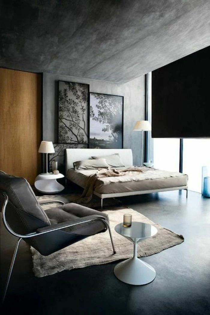 modern or industrial bedroom, with blue grey paint on walls, contrasting light wooden door, pale beige rug, accent color with gray walls