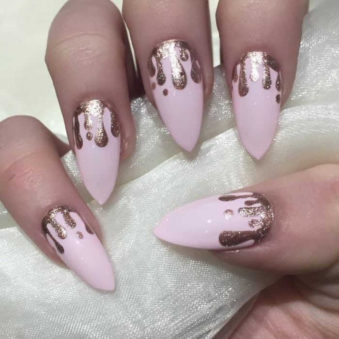 baby pink nail polish, with melting effect, made with rose gold glitter, on sharp oval manicure