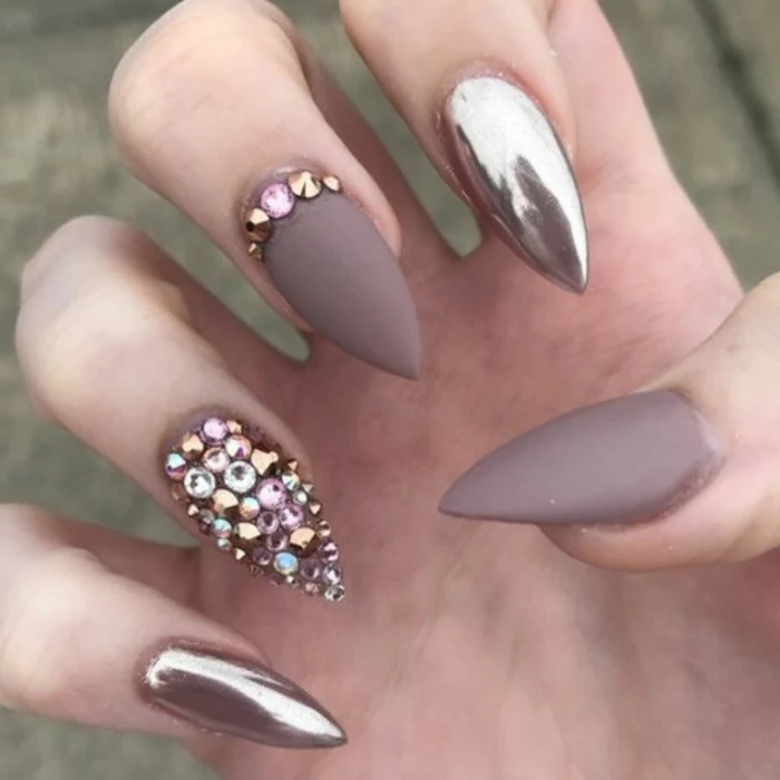 understated and chic manicure, matte beige nail polish, and rose gold metallic effect, pink and pale blue rhinestone stickers