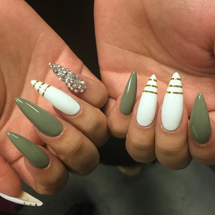 olive green and white, sharp and long stiletto nails, decorated with golden stripes, and rhinestone stickers
