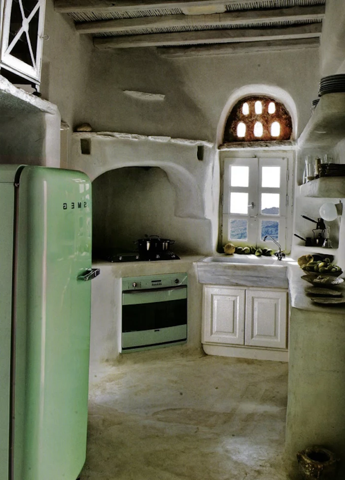 country kitchen decorating ideas, peasant style home, with modern pale green stove, and matching fridge, asymmetrical walls and rounded corners