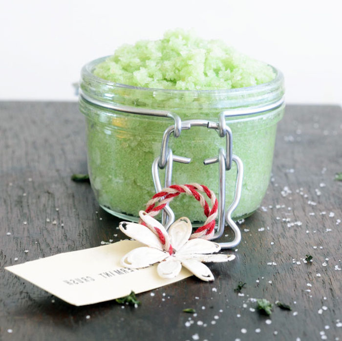 foot scrub in pale green, inside small clear mason jar, with snap close, mothers day presents, decorated with white and red thread, label and paper flower