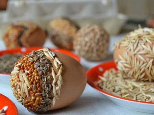 seeds from different varieties, easter crafts for adults, chia and oats, millet and others, used to decorate easter eggs