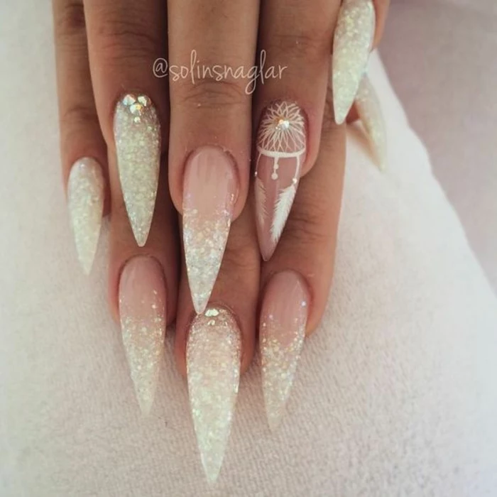 claw nails, with french style manicure, long and sharp, with pink bottom part, and white tips covered in glitter, rhinestones and little white, hand-drawn dream catcher detail