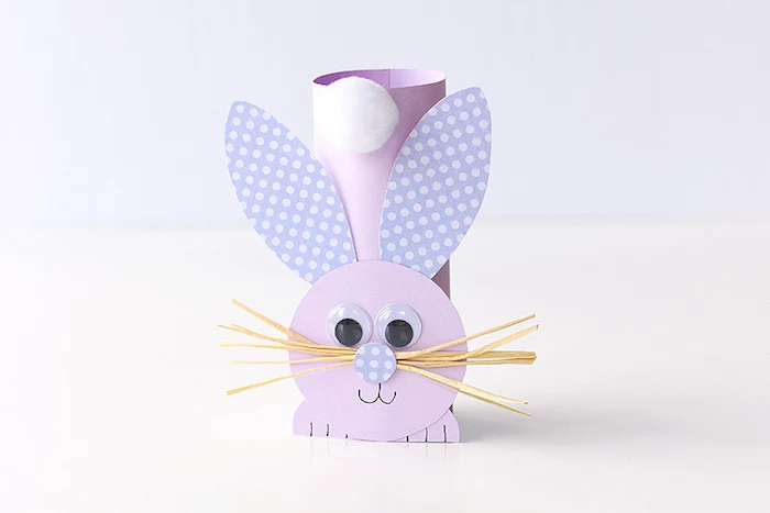 completed easter bunny decoration, easter diy, made from pale purple card, with spotted violet ears, white cotton ball tail, straw-like whiskers