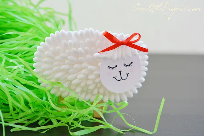 finished lamb decoration, craft ideas for kids, standing near bright green Easter grass