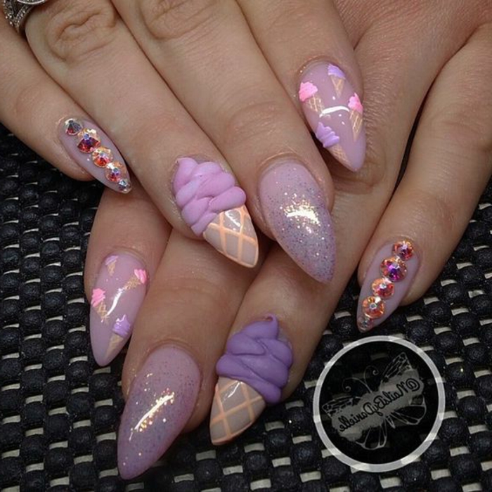 ice-cream cone 3D shapes, on pastel pink-colored manicure, decorated with colorful rhinestones, glitter and tiny ice cream stickers, in pink and violet