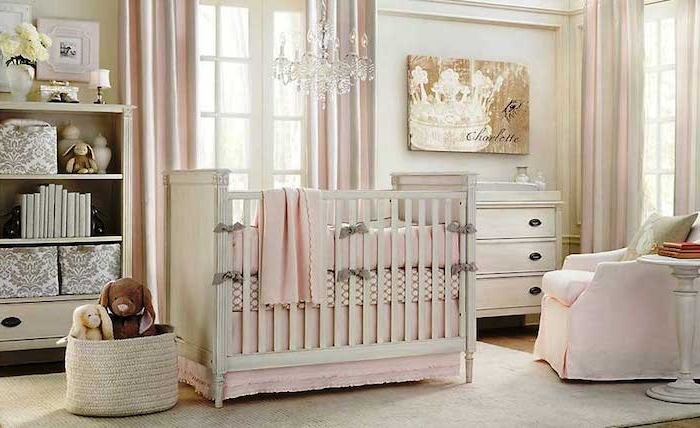 stuffed animal toys, in pale beige basket, near white crib, with pink bedding, girl nursery themes , spacious room with white walls, and pale pink curtains