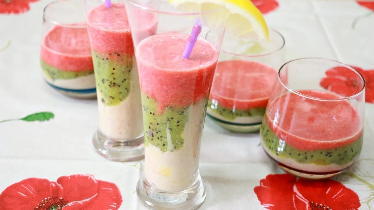 watermelon and kiwi drink, mixed with yoghurt, pink and green smoothie, in three tall and two tumbler glasses
