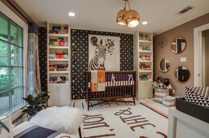 spacious room with large framed zebra painting, on dark gray wall, with white and yellow dots, brown wooden crib, baby nursery ideas, shelves and mirrors