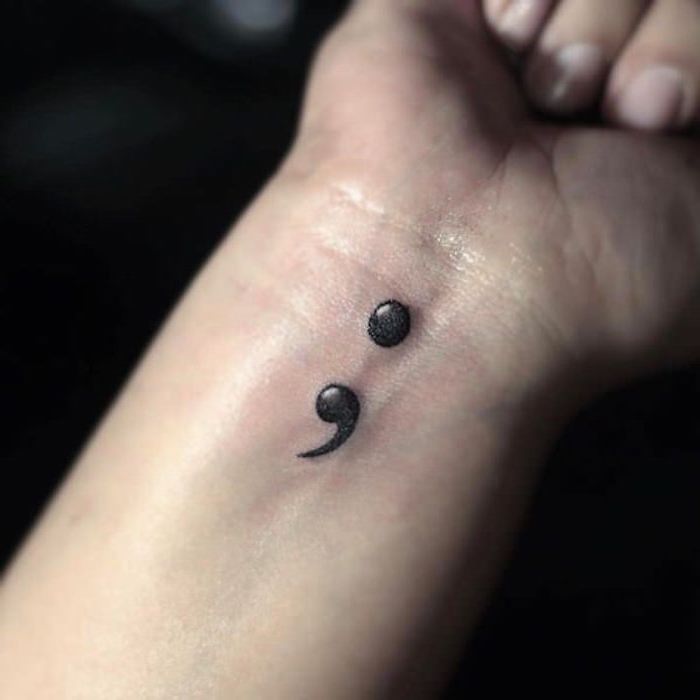 glossy optical illusion tattoo, depicting a black semicolon, with 3D effect, great example of a semicolon tattoo on wrist 