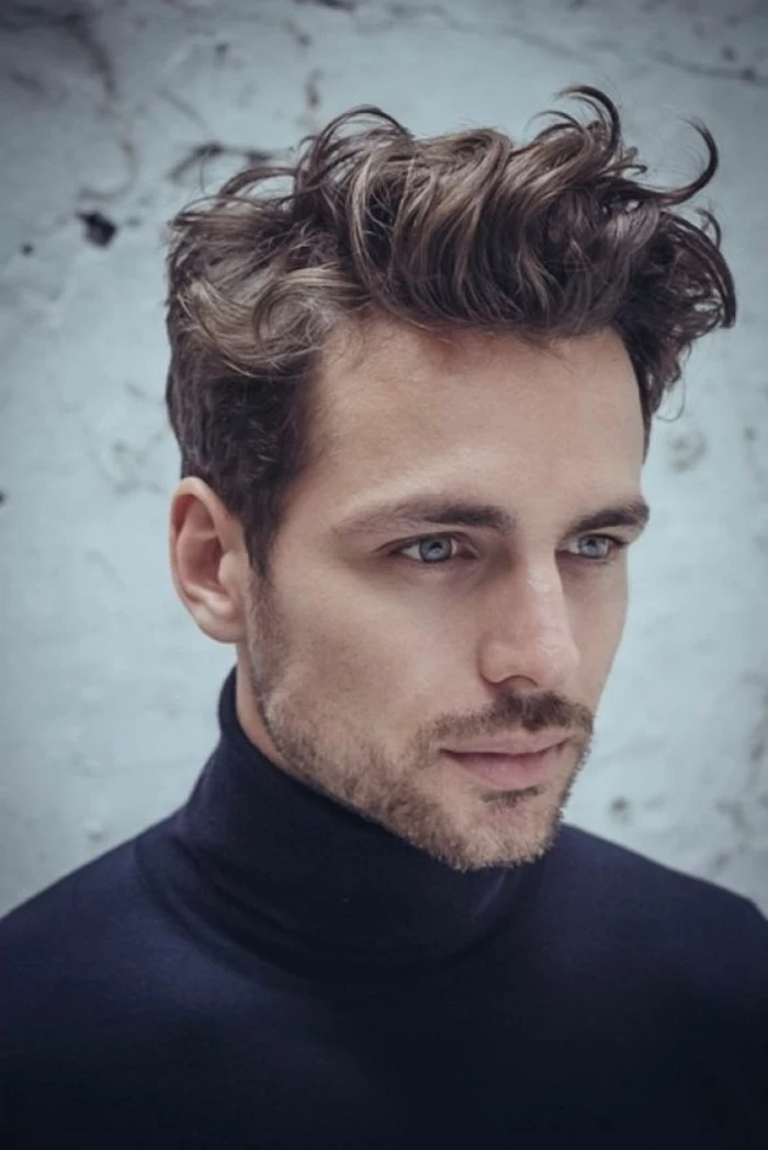 soft brunette curls, styled in a casual messy manner, curly hairstyles, on blue-eyed man, with short beard and mustache, wearing a black turtleneck