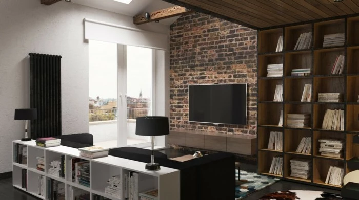 brown and white wooden library shelves, inside room with one brick wall, black sofa and lamp, multicolored rug on the floor, and wooden beams on the ceiling, small apartment living room ideas 
