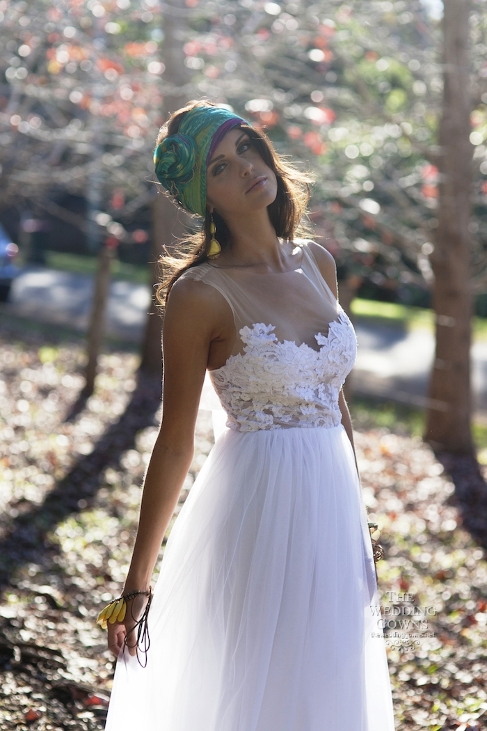 beach wedding dresses, romantic white gown, with semi-sheer embroidered top, and floaty tulle skirt, on young brunette woman, wearing a green boho head scarf