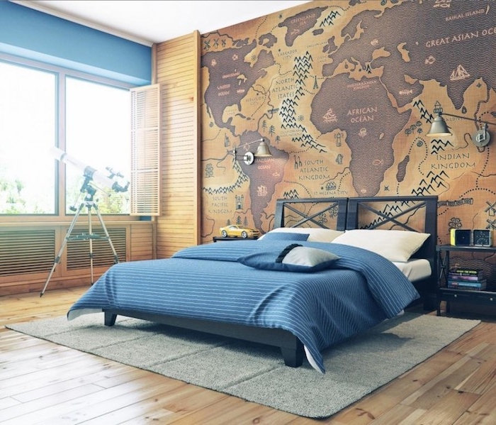 reversed world map, in beige and dark brown, with continents labeled as oceans, and vice versa, large wall art, covering a wall near a black bed, with white and blue bedding