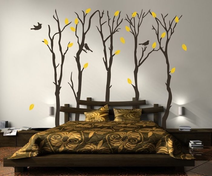 yellow leaves and three small birds, on five dark brown trees, large wall art, on white wall, near a brown bed, with asian-inspired headboard