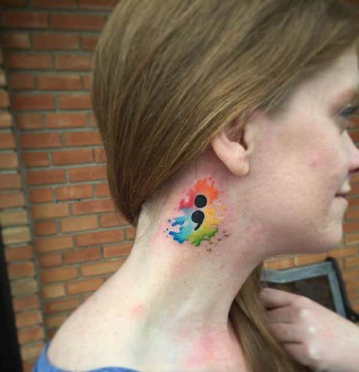 semicolon movement tattoo, with rainbow colors, and a splashed watercolor effect, on the side of a smiling, young girl's neck