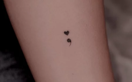 tiny heart semicolon tattoo