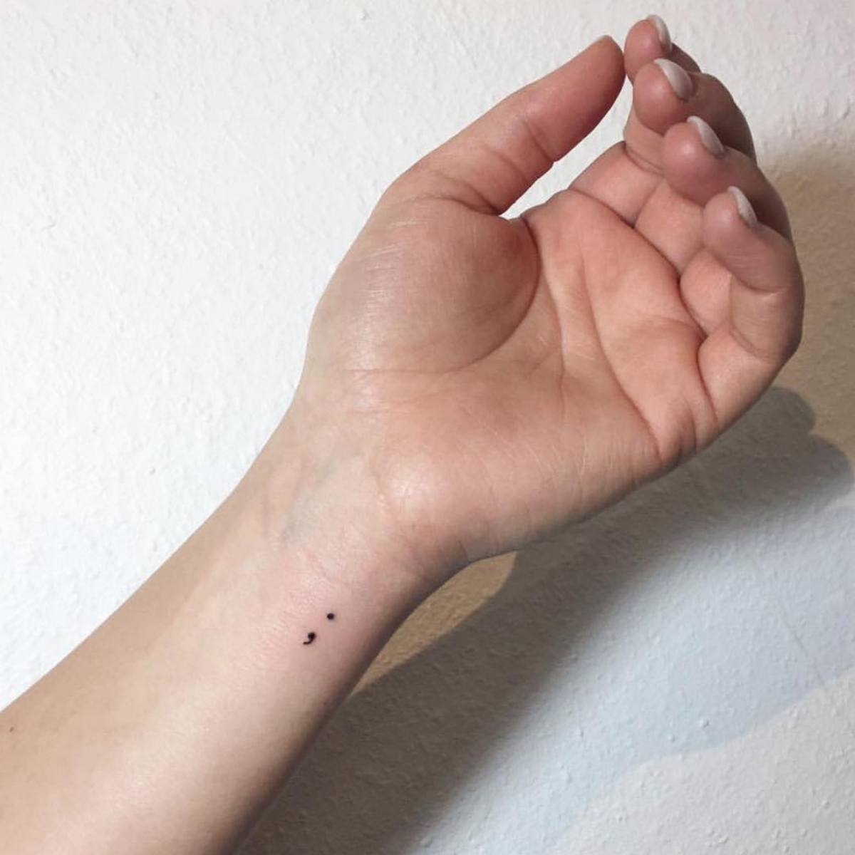 tiny semicolon on wrist