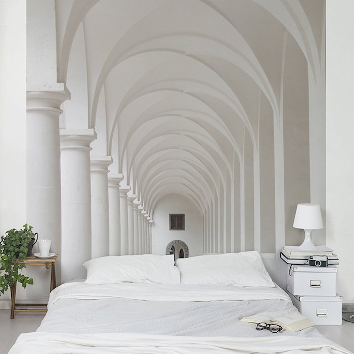 bedroom decorating ideas, 3D effect photo wallpaper, depicting a white tunnel with pillars and arches, near a white double bed