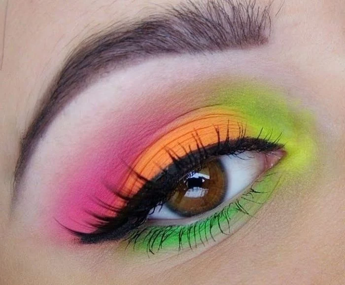 makeup looks, brown eye with black eyeliner, and neon eyeshadow, in pink and orange, green and yellow, seen in extreme closeup