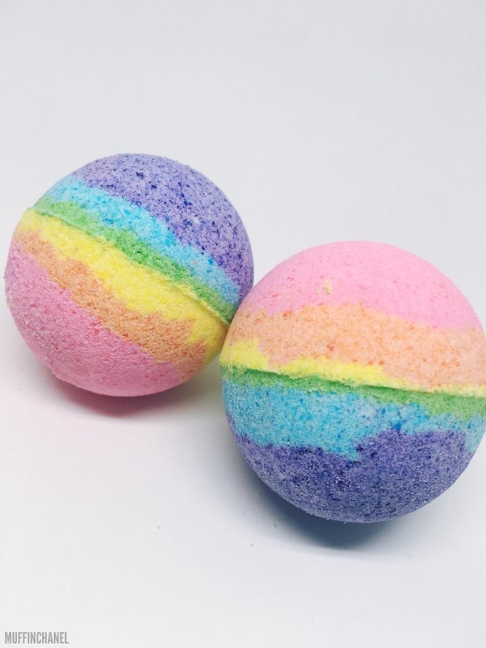 multicolored striped rainbow bath balls, a set of two, placed on a white background