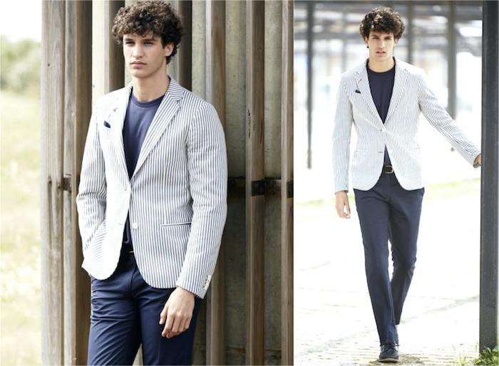 navy and white striped blazer, worn over dark blue t-shirt, and matching trousers, casual dress code, on young curly brunette man