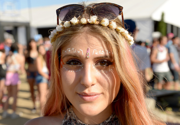 peach colored highlights, on long blonde hair, young woman with nude beige lipstick, and face decorated with white paint, cute makeup looks, flower crown and sunglasses