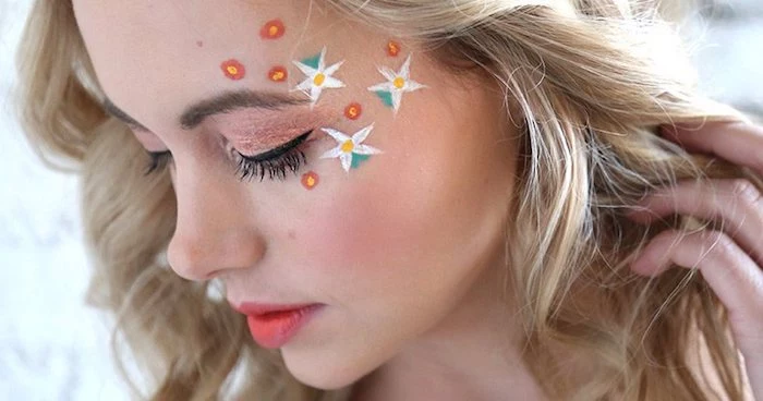 tiny red and yellow flowers, and bigger white yellow and green blossoms, painted on a girl's face, cute makeup looks, pale pink eyeshadow, black eyeliner and pastel red lipstick